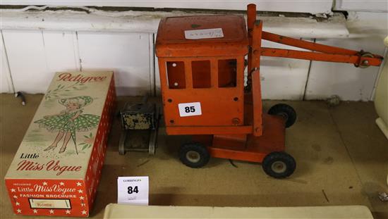 Toy crane, tank & doll